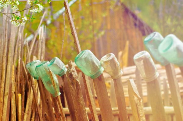 Glass Jar On Wooden Fence